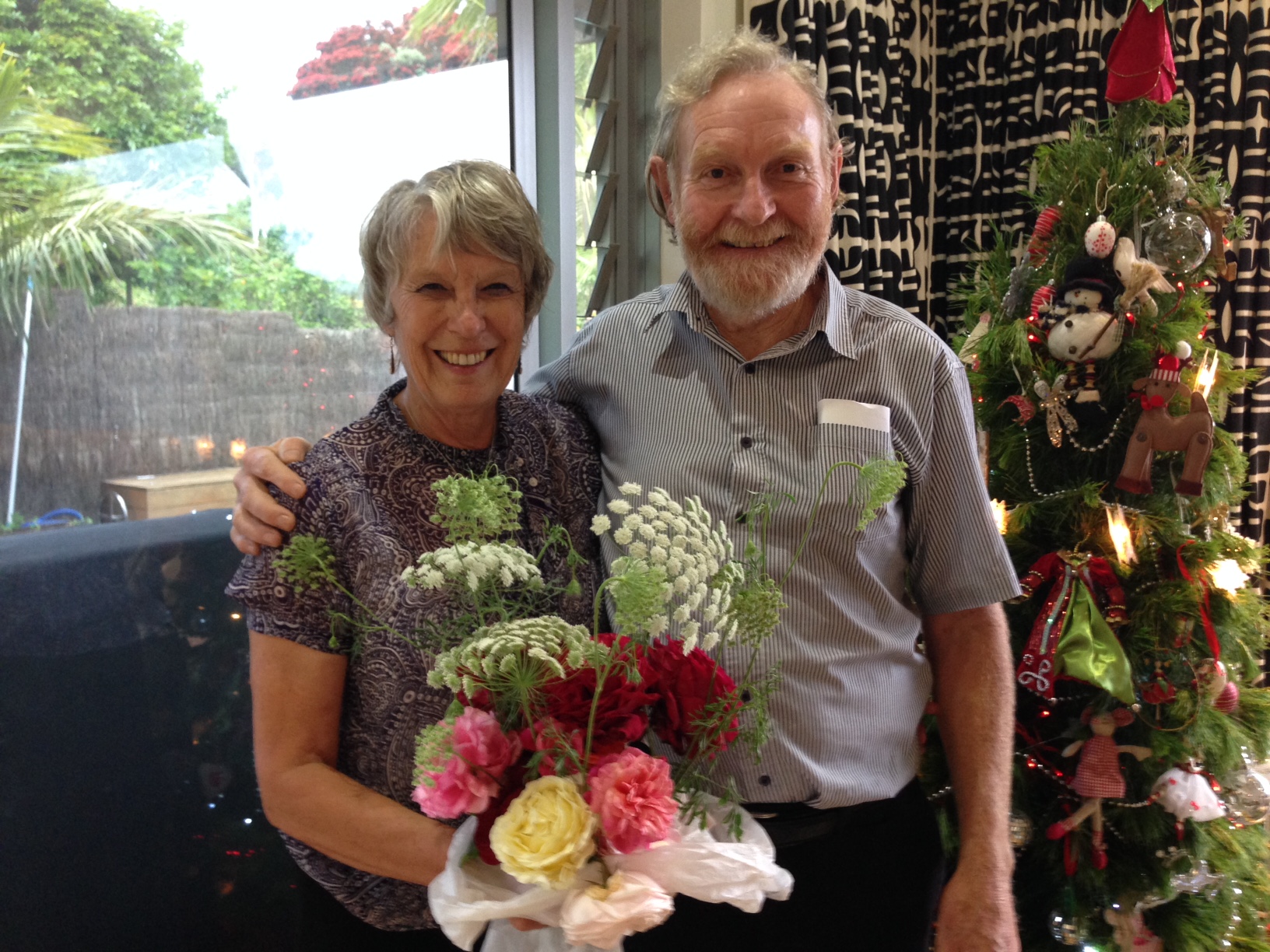 Evelyn receives beautiful home grown flowers from Trevor, who she has worked with for twelve years